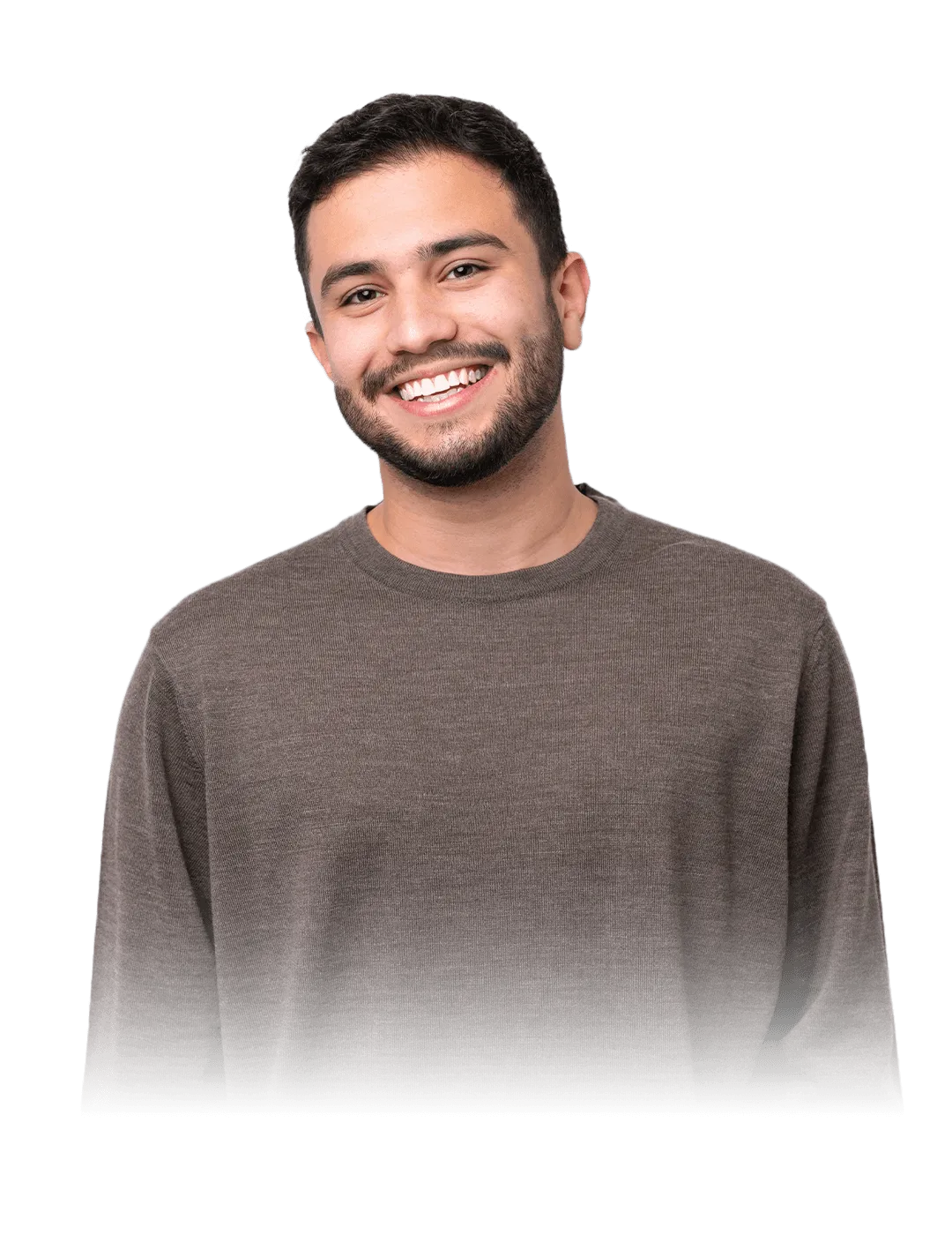 A smiling person with short dark hair and a trimmed beard, wearing a brown sweater, stands in front of a geometric black background with blue and red lines.