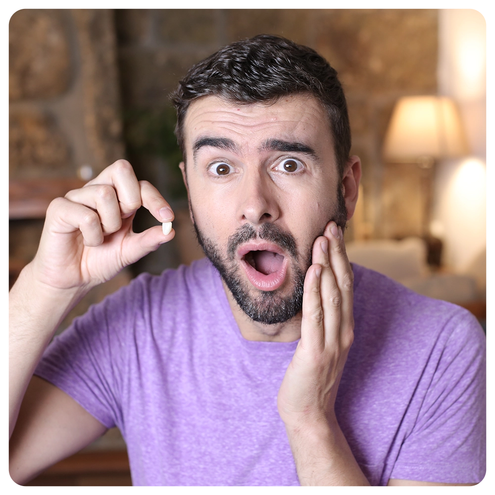 Young man losing a tooth