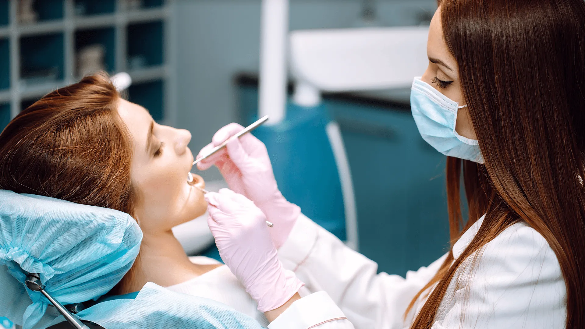 Professional woman dentist is working. Woman patient during a dental procedure