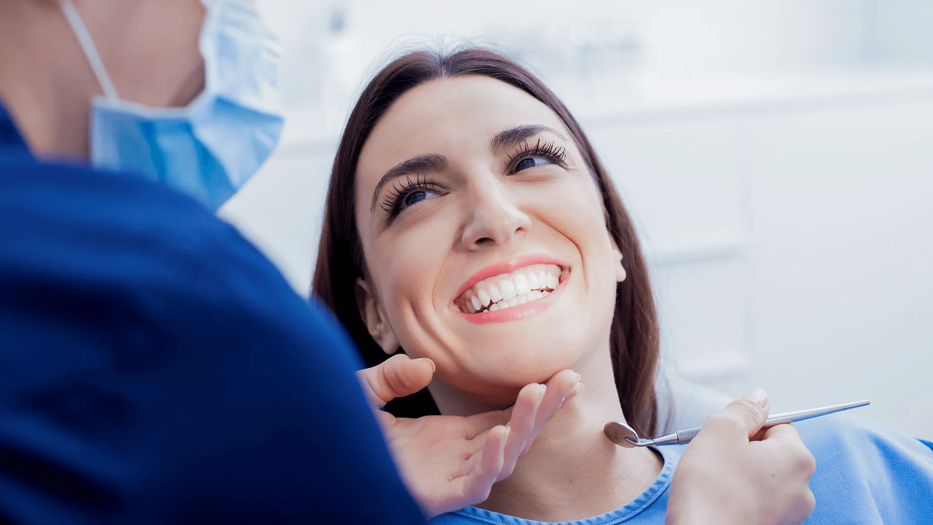 At the dentist. Female dentist in action.