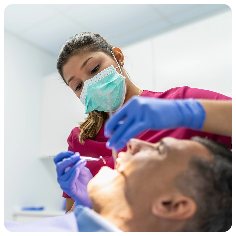 Young Dentist Woman Doing a Check Up to a Patient. 
