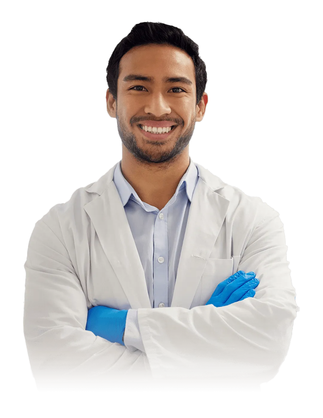 A smiling man in a white lab coat and blue gloves stands with arms crossed.