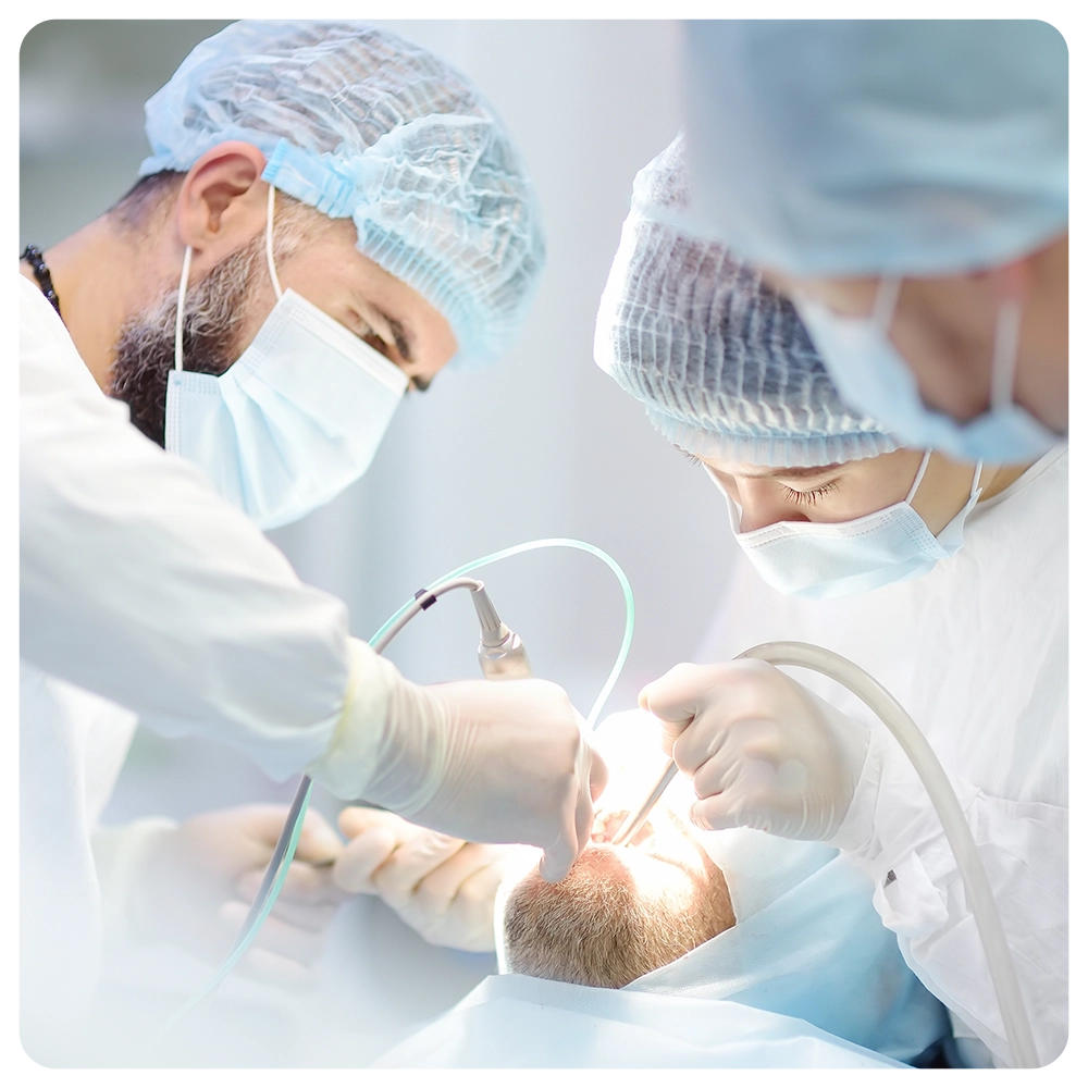 Surgeons and nurse during a dental operation