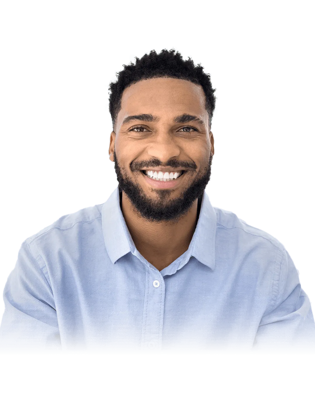 A man with short curly hair and a beard, smiling and wearing a light blue button-up shirt, is in front of a black background with blue and red geometric lines forming a chevron pattern.