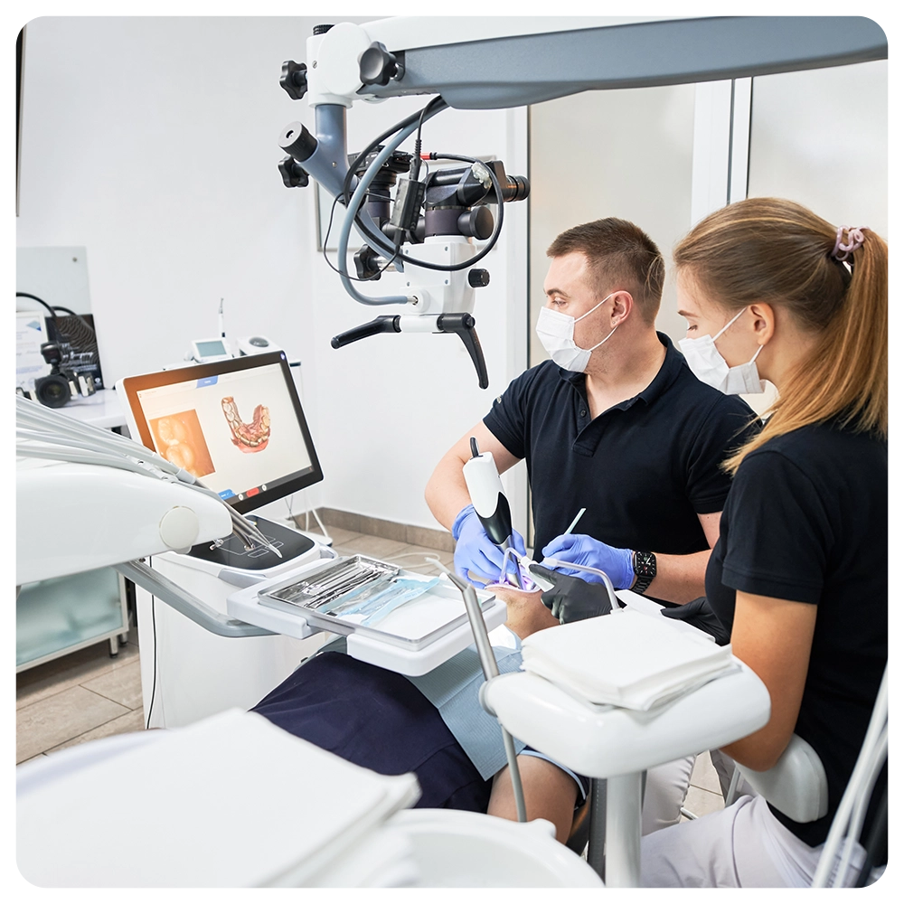 Dentist scanning patient's teeth with modern machine for intraoral scanning. 