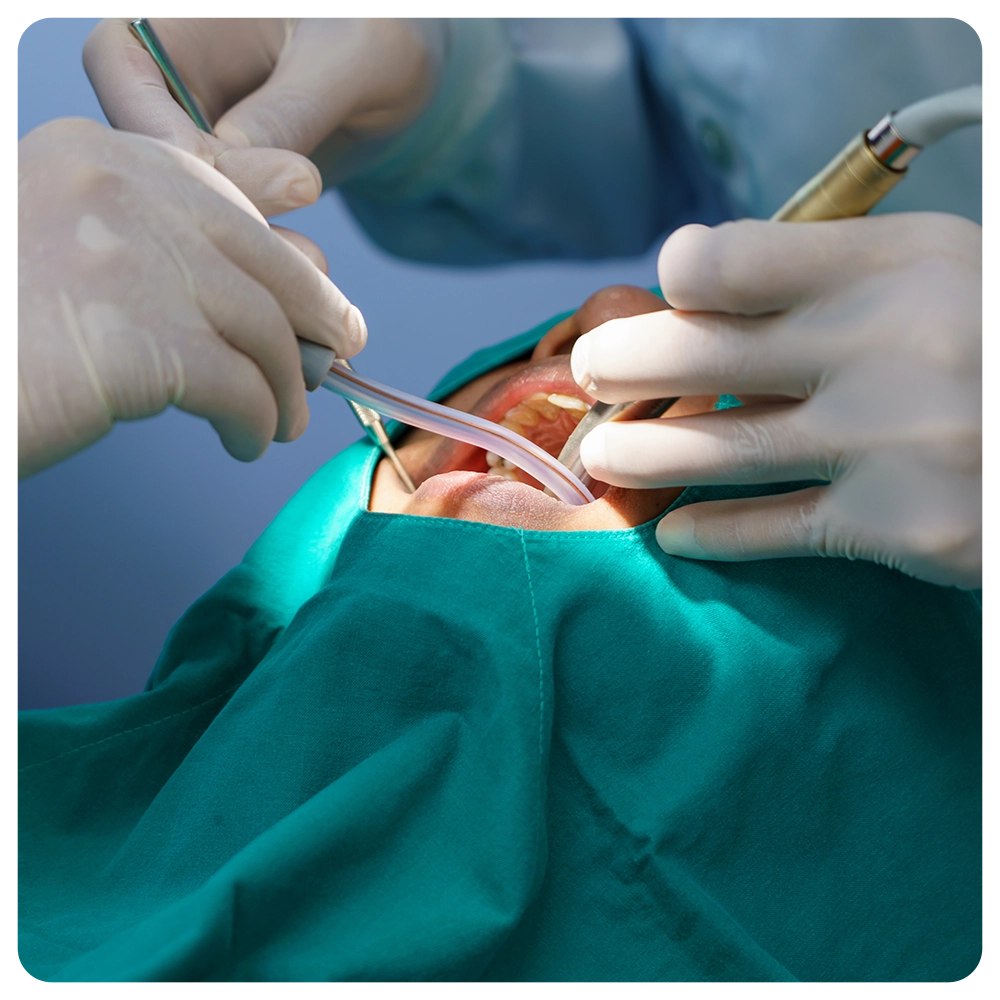 doctor cleaning the teeth patient with ultrasonic tool